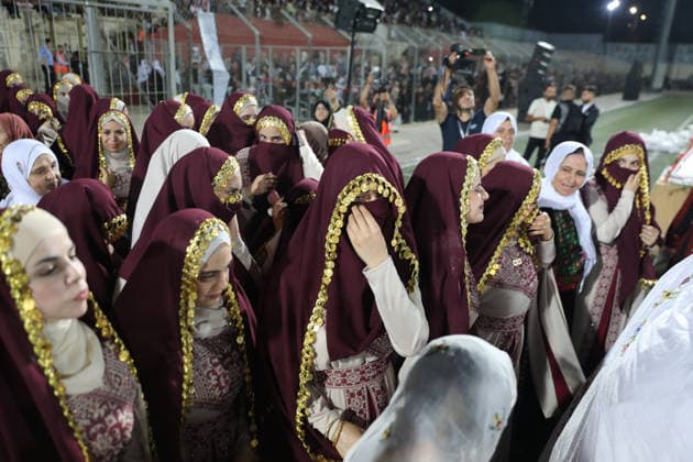 Mass Wedding Brings Together 44 Couples in Dura Brides and grooms take part in a mass wedding ceremony for 44 couples in Dura, near the West Bank city of Hebron, on September 26, 2026. Thousands of family members, residents and friends attended the celebration to mark the weddings. Photo by Mamoun Wazwaz apaimages Hebron West Bank Palestinian Territory 260926_Hebron_MW_1_00(19) Copyright: xapaimagesxMamounxWazwazx xapaimagesx