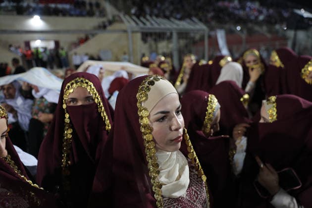 Mass Wedding Brings Together 44 Couples in Dura Brides and grooms take part in a mass wedding ceremony for 44 couples in Dura, near the West Bank city of Hebron, on September 26, 2026. Thousands of family members, residents and friends attended the celebration to mark the weddings. Photo by Mamoun Wazwaz apaimages Hebron West Bank Palestinian Territory 260926_Hebron_MW_1_00(20) Copyright: xapaimagesxMamounxWazwazx xapaimagesx