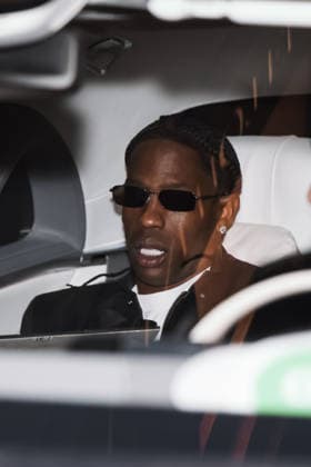 IPA89011571 - Milan, Celebrity Sightings During Milan Fashion Week: Women s Collection Spring Summer 2027 - Women s Fashion, Spring Summer 2027. Pictured: Travis Scott (U.S. rapper) leaving the Armani Hotel on his way to the Bottega Veneta fashion show  Copyright: xAlessandroxBremecx xx IPA89011571