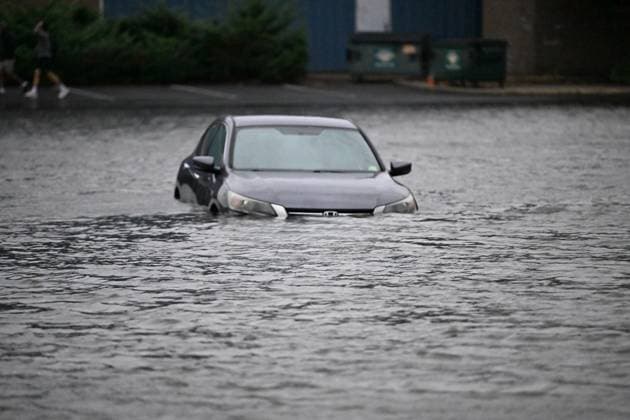 September 26, 2026, Edgewater, New Jersey, USA: A vehicle is seen submerged in flood waters in the parking lot of the Comfort Inn Edgewater on Hudson River during a nor easter storm in Edgewater, New Jersey, United States on Saturday, Sept. 26, 2026. Heavy rain and strong winds battered the northeastern United States as an unusually powerful autumn storm intensified, forcing the cancelation of hundreds of flights and leaving tens of thousands of people without power. New York, Boston and Philadelphia were all in the crosshairs of the Nor easter -- so labeled for its northeasterly winds -- as authorities warned of potential major flooding and road closures. Edgewater USA - ZUMAs197 20260926_aaa_s197_287 Copyright: xKylexMazzax