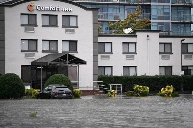 September 26, 2026, Edgewater, New Jersey, USA: A vehicle is seen submerged in flood waters in the parking lot of the Comfort Inn Edgewater on Hudson River during a nor easter storm in Edgewater, New Jersey, United States on Saturday, Sept. 26, 2026. Heavy rain and strong winds battered the northeastern United States as an unusually powerful autumn storm intensified, forcing the cancelation of hundreds of flights and leaving tens of thousands of people without power. New York, Boston and Philadelphia were all in the crosshairs of the Nor easter -- so labeled for its northeasterly winds -- as authorities warned of potential major flooding and road closures. Edgewater USA - ZUMAs197 20260926_aaa_s197_290 Copyright: xKylexMazzax