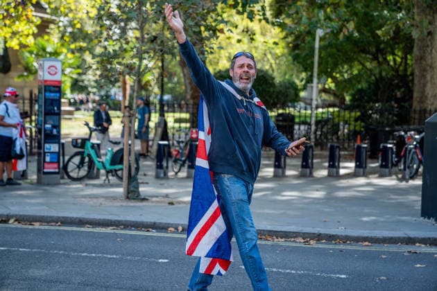 September 26, 2026, London, United Kingdom: An anti-migrant protestor wearing a Union Jack flag across his shoulders takes part in a protest against grooming gangs targeting British girls. The event organised by Together For The Children in collaboration with Football Lads on National Survivors Day stands in solidarity with survivors of child sexual abuse and sexual violence while demanding stronger child protections and legal reforms, as well as a curb on illegal migration. London United Kingdom - ZUMAs197 20260926_aaa_s197_317 Copyright: xLabxMox