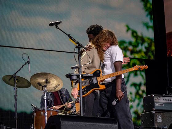 September 26, 2026, Virginia Beach, Virginia, USA: JESSE WELLES shares a hug with MON ROVIA following the end of a joint performance at Farm Aid 2026. Through music and family farm produced food, and farmer presentations, this annual festival shines a spotlight on the critical need for family farms to succeed. Virginia Beach USA - ZUMAd155 20260926_znp_d155_027 Copyright: xSuexDorfmanx