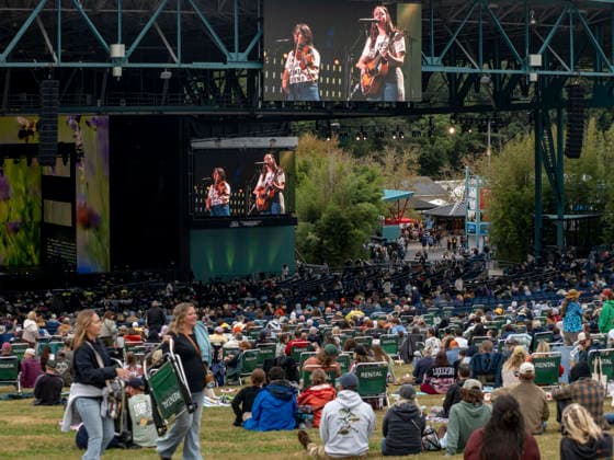 September 26, 2026, Virginia Beach, Virginia, USA: SARA WILKINS and SARAH JAROSZ of the band IM WITH HER are shown on jumbo screens as they play at Farm Aid 2026. Through music and family farm produced food, and farmer presentations, this annual festival shines a spotlight on the critical need for family farms to succeed. Virginia Beach USA - ZUMAd155 20260926_znp_d155_013 Copyright: xSuexDorfmanx