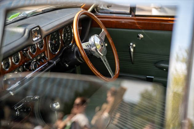 September 26, 2026, London, United Kingdom: The interior of a vintage green Jaguar on display during the King™s Cross Classic Car Boot Sale in London. The Kings Cross Classic Car Boot Sale returned to Granary Square and Stable Street, King™s Cross, London, for its 11th year. Held several times throughout the year, the event brings together vintage fashion, second-hand clothing, jewellery, homewares, collectables and vinyl records alongside classic cars, motorcycles and commercial vehicles. Visitors browsed stalls and traders, with many making a special effort to dress in period clothing inspired by the 1950s, 1960s and 1970s.continuing a tradition associated with the event. London United Kingdom - ZUMAs197 20260926_aaa_s197_349 Copyright: xJamesxWilloughbyx