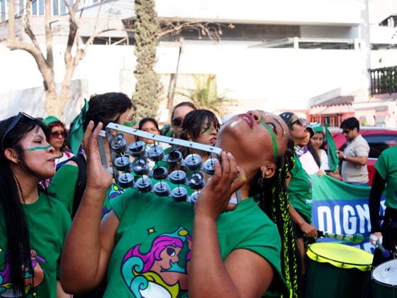 September 26, 2026, Lima, Lima, Peru: Woman playing a tambourine when on International Safe Abortion Day hundreds of women, wearing green scarf, carry out a demonstration demanding legal, safe, and free abortion in Peru, as part of the comprehensive health of girls, adolescents, women, and anyone with the possibility of gestating. Abortion in Peru, a conservative country, is illegal and punishable Lima Peru - ZUMAg240 20260926_zip_g240_012 Copyright: xCarlosxGarciaxGranthonx