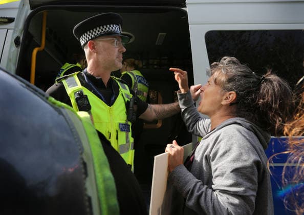 September 26, 2026, Huntingdon, United Kingdom: An activist argues with police officers as a colleague is arrested during the protest. Save The Dogs UK march to end animal testing culminating in a rally at MBR Acres in Huntingdon. The facility produces beagle puppies for the vivisection industry. The march to MBR Acres was held at the same time as a two-week march by animal activists in the USA arrived at Marshall BioResources in New York. Both sets of activists claim ™Two Countries, Two Marches. One Shared Message™ The protesters insist both Marshall BioResourses and MBR Acres are closed and demand a future beyond animal testing. Huntingdon United Kingdom - ZUMAs197 20260926_aaa_s197_463 Copyright: xMartinxPopex