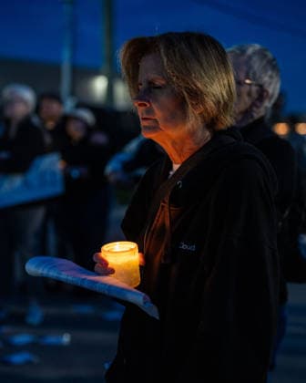 September 26, 2026, Broadview, Illinois, USA: An activist holding a candle during a vigil in front of the Broadview ICE Detention Facility, memorializing the one year passed since Operation Midway Blitz rocked Chicagoland Broadview USA - ZUMAr170 20260926_znp_r170_024 Copyright: xChrisxRihax