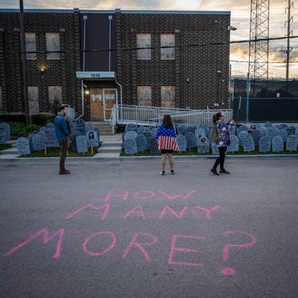 September 26, 2026, Broadview, Illinois, USA: Outside the Broadview ICE Facility, an activists stand over the cardboard gravestones bearing the names of those killed by ICE or in custody in the one year since Operation Midway Blitz in Chicagoland. Chalk on the ground reads How Many More? Broadview USA - ZUMAr170 20260926_znp_r170_014 Copyright: xChrisxRihax