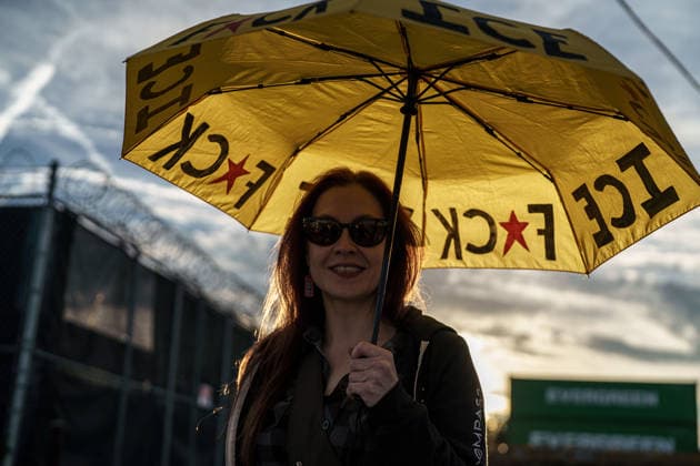 September 26, 2026, Broadview, Illinois, USA: An activist carrying an umbrella that reads F*CK ICE outside the Broadview ICE Detention Center, one year after Operation Midway Blitz in Chicagoland Broadview USA - ZUMAr170 20260926_znp_r170_004 Copyright: xChrisxRihax