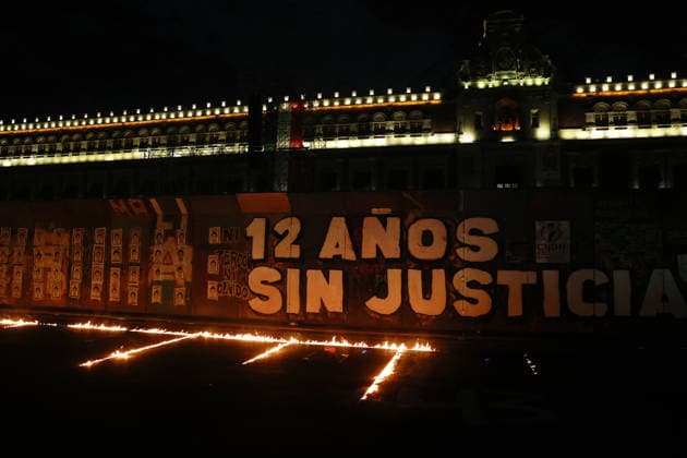 Mexico marks 12 years since disappearance of 43 Ayotzinapa students MEXICO CITY, MEXICO - SEPTEMBER 26: Fires burn on the ground outside the National Palace during a rally to mark 12 years since the disappearance of 43 students from Ayotzinapa, Guerrero state, in Mexico City, Mexico on September 26, 2026. Thousands of people took part in a rally marking 12 years since the disappearance of 43 students from Ayotzinapa, Guerrero state, as the government is set to present an updated report on the investigation on Monday. Daniel Cardenas Anadolu Mexico city Mexico. Editorial use only. Please get in touch for any other usage.  Copyright: x2026xAnadoluxDanielxCardenasx