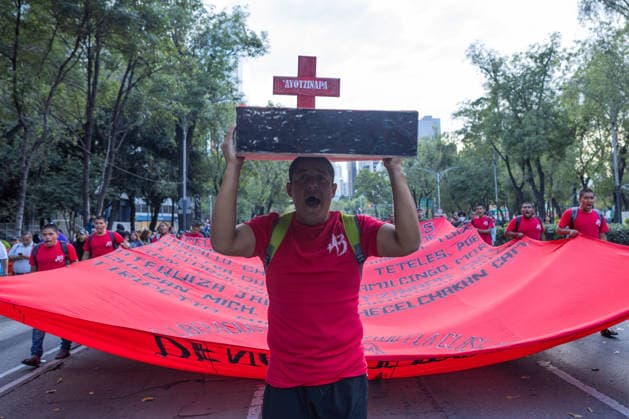 September 26, 2026, Mexico City, Mexico: Families of the 43 students from the Raul Isidro Burgos Rural Teachers College of Ayotzinapa, students and social organizations took part in a march from the Angel of Independence to the Zocalo in Mexico City, marking 12 years since the students disappeared in Iguala, Guerrero. Demonstrators demanded truth and justice. Mexico City Mexico - ZUMAl178 20260926_znp_l178_024 Copyright: xCristianxLeyvax