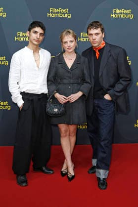 Andronikos Korakas, Jella Haase, and Joshua Hupfauer at the premiere of the feature film *Kinder der Sonne* (*Children of the Sun*) at the 34th Filmfest Hamburg 2026 at Cinemaxx Dammtor in Hamburg, September 26, 2026 Foto:xC.xTamckex xFuturexImagex kinder_6915