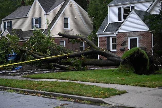 September 27, 2026, Ridgewood, New Jersey, USA: A tree is seen uprooted with wires down outside of a home on Gilbert Street during a nor easter storm in Ridgewood, New Jersey, United States, on Sunday, September 27, 2026. Heavy rain and strong winds battered the northeastern United States as an unusually powerful autumn storm intensified, forcing the cancellation of hundreds of flights and leaving tens of thousands of people without power. New York, Boston and Philadelphia were among the areas affected by the storm, as authorities warned of potential major flooding and road closures. Ridgewood USA - ZUMAs197 20260927_aaa_s197_007 Copyright: xKylexMazzax