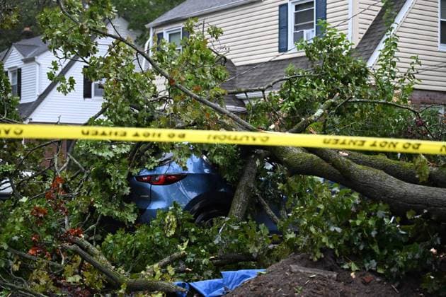 September 27, 2026, Ridgewood, New Jersey, USA: A tree is seen uprooted with wires down outside of a home on Gilbert Street during a nor easter storm in Ridgewood, New Jersey, United States, on Sunday, September 27, 2026. Heavy rain and strong winds battered the northeastern United States as an unusually powerful autumn storm intensified, forcing the cancellation of hundreds of flights and leaving tens of thousands of people without power. New York, Boston and Philadelphia were among the areas affected by the storm, as authorities warned of potential major flooding and road closures. Ridgewood USA - ZUMAs197 20260927_aaa_s197_008 Copyright: xKylexMazzax