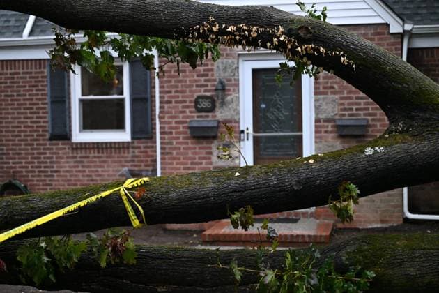 September 27, 2026, Ridgewood, New Jersey, USA: A tree is seen uprooted with wires down outside of a home on Gilbert Street during a nor easter storm in Ridgewood, New Jersey, United States, on Sunday, September 27, 2026. Heavy rain and strong winds battered the northeastern United States as an unusually powerful autumn storm intensified, forcing the cancellation of hundreds of flights and leaving tens of thousands of people without power. New York, Boston and Philadelphia were among the areas affected by the storm, as authorities warned of potential major flooding and road closures. Ridgewood USA - ZUMAs197 20260927_aaa_s197_005 Copyright: xKylexMazzax