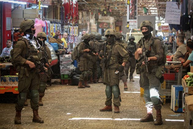 Israeli Soldiers Deploy During Raid in Nablus Old City Israeli soldiers deploy during a raid on the Old City of Nablus, West Bank, on September 27, 2026. Israeli forces entered the city and spread through several areas, including streets leading toward the Old City. Local sources reported searches and arrests, and said 12 students suffered from tear gas inhalation after gas canisters were fired near a school close to the Old City. Photo by Mohammed Nasser apaimages Nablus West Bank Palestinian Territory 270926_Nablus_MN_00(4) Copyright: xapaimagesxMohammedxNasserx xapaimagesx