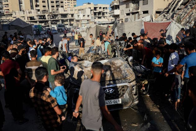 Palestinians Gather at Site of Israeli Strike in Gaza City Palestinians gather at the site of an Israeli airstrike that targeted a vehicle near al-Sinaa junction in Gaza City on September 27, 2026. The strike killed one Palestinian and wounded others, according to local sources. Photo by Bilal Osama apaimages Gaza city Gaza Strip Palestinian Territory 270926_Gaza_BO_01(14) Copyright: xapaimagesxBilalxOsamax xapaimagesx