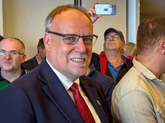 Aurich, Germany, September 27, 2026: Olaf Wiltfang (SPD) on election night at the Aurich County Hall, surrounded by his supporters. The SPD candidate wins the runoff election for the office of district administrator in Aurich County and becomes the new district administrator. Copyright: xHans-JoachimxSteinsiekx