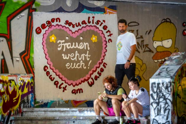 Against Sexual Violence at the Wasen: Graffiti at the Hall of Fame near the Cannstatter Wasen. According to the organizers, the Cannstatter Volksfest is one of the most beautiful and largest folk festivals in the world. Around three million guests are expected again through October 11. September 27, 2026, Stuttgart, Baden-Württemberg, Germany