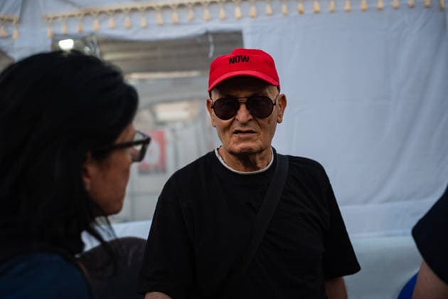 September 27, 2026, Tel Aviv, Tel Aviv, Israel: A supporter pays his respects at a Sukka, a tent for the holiday of Sukkot, built by families of former hostages In Hostages Square to commemorate 3 years since October 7th Tel Aviv Israel - ZUMAg280 20260927_znp_g280_005 Copyright: xYoavxGinsburgx