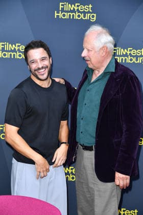 Kostja Ullmann and Axel Milberg at the FilmFest Hamburg premiere of *The Third Wedding* in Hamburg on September 29, 2026