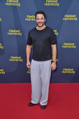Kostja Ullmann at the FilmFest Hamburg premiere of *The Third Wedding* in Hamburg on September 29, 2026