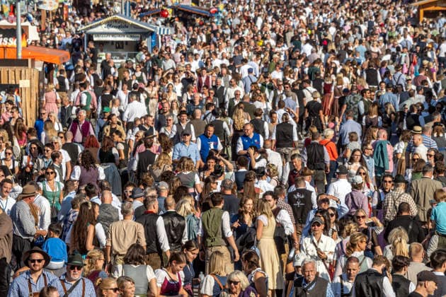 Oktoberfest 2026, thousands of people streaming across the festival grounds, Oktoberfest visitors on Matthias Pschorr Street, panoramic view from the Bavaria statue, perfect Oktoberfest weather, Munich, September 30, 2026, Germany, Munich, September 30, 2026, Oktoberfest 2026, thousands