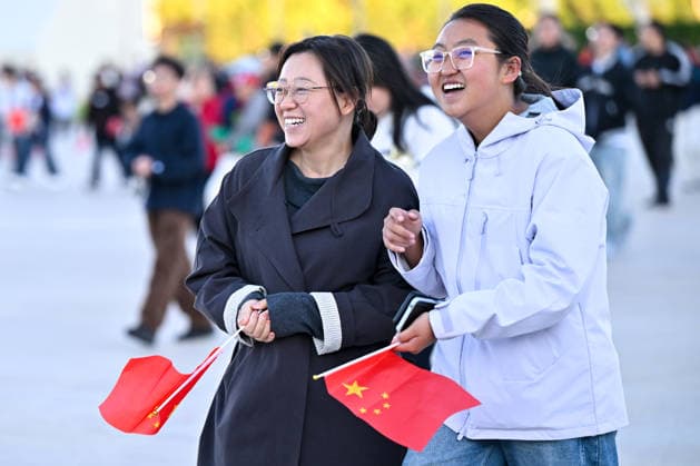 (261001) -- BEIJING, Oct. 1, 2026 -- People attend a flag-raising ceremony marking the 77th anniversary of the founding of the People s Republic of China at Tian anmen Square in Beijing, capital of China, Oct. 1, 2026. ) CHINA-BEIJING-NATIONAL DAY-FLAG-RAISING CEREMONY (CN) LiuxJinhai