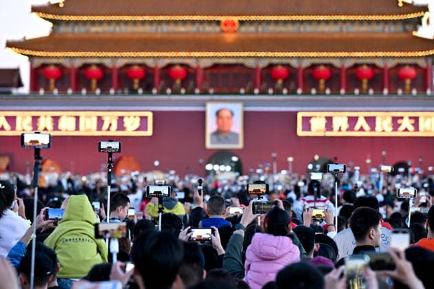 (261001) -- BEIJING, Oct. 1, 2026 -- People attend a flag-raising ceremony marking the 77th anniversary of the founding of the People s Republic of China at Tian anmen Square in Beijing, capital of China, Oct. 1, 2026. ) CHINA-BEIJING-NATIONAL DAY-FLAG-RAISING CEREMONY (CN) LiuxJinhai 