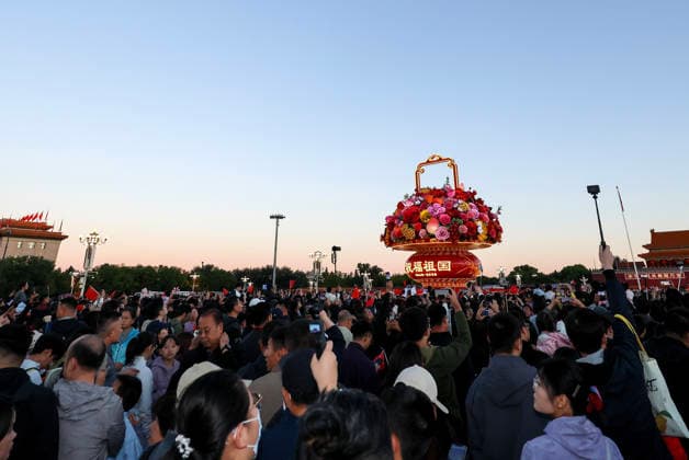 (261001) -- BEIJING, Oct. 1, 2026 -- People attend a flag-raising ceremony marking the 77th anniversary of the founding of the People s Republic of China at Tian anmen Square in Beijing, capital of China, Oct. 1, 2026. ) CHINA-BEIJING-NATIONAL DAY-FLAG-RAISING CEREMONY (CN) LiuxJinhai