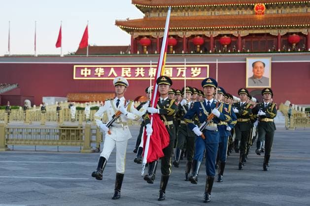 (261001) -- BEIJING, Oct. 1, 2026 -- A flag-raising ceremony marking the 77th anniversary of the founding of the People s Republic of China is held at Tian anmen Square in Beijing, capital of China, Oct. 1, 2026. ) XINHUA PHOTOS OF THE DAY JuxHuanzong