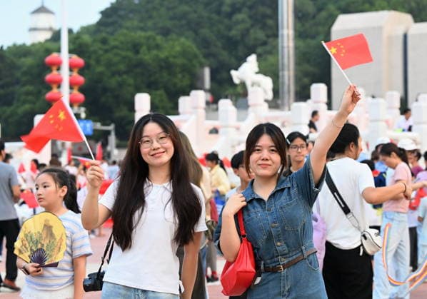 (261001) -- BEIJING, Oct. 1, 2026 -- People attend a flag-raising ceremony marking the 77th anniversary of the founding of the People s Republic of China at Wuyi Square in Fuzhou, southeast China s Fujian Province, Oct. 1, 2026. People celebrated the 77th anniversary of the founding of the People s Republic of China in various ways on Thursday. ) CHINA-NATIONAL DAY-CELEBRATION (CN) LinxShanchuan
