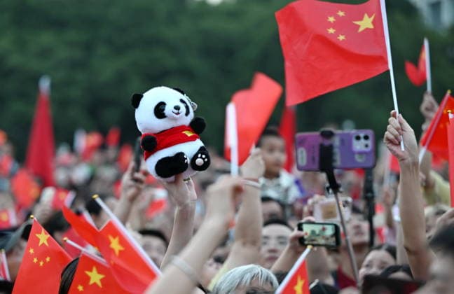 (261001) -- BEIJING, Oct. 1, 2026 -- People attend a flag-raising ceremony marking the 77th anniversary of the founding of the People s Republic of China at Wuyi Square in Fuzhou, southeast China s Fujian Province, Oct. 1, 2026. People celebrated the 77th anniversary of the founding of the People s Republic of China in various ways on Thursday. ) CHINA-NATIONAL DAY-CELEBRATION (CN) LinxShanchuan