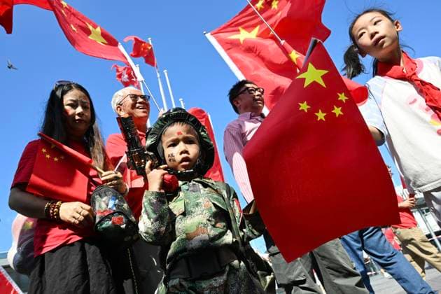 RECORD DATE NOT STATED China s National Day In Hong Kong A child wearing Chinese military uniform, holding a national flag of China and a toy gun on October 1, 2026 in Hong Kong. Today is the China s National Day. (Photo by STR Nexpher Images) Hong Kong