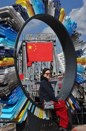 HARBIN, CHINA - OCTOBER 01: National flags are displayed on street lamps and waved by tourists at the Binzhou Bridge on October 1, 2026 in Harbin, Heilongjiang Province of China. The city has decorated main roads and landmarks with flags and floral displays to celebrate the National Day holiday.  Copyright: xVCGx 111670933221