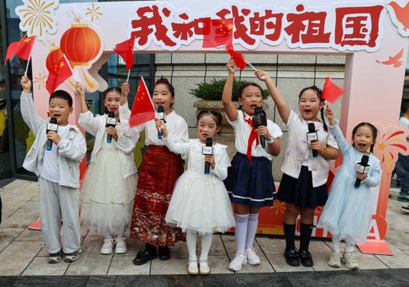DUJIANGYAN, CHINA - OCTOBER 01: Residents sing and dance to celebrate the National Day on October 1, 2026 in Dujiangyan, Sichuan Province of China.  Copyright: xVCGx 111670938984