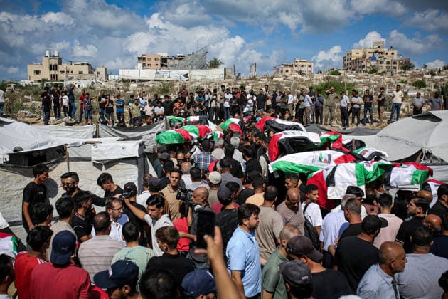Palestinians Hold Mass Funeral for 105 Recovered from Gaza Rubble Palestinians take part in a mass funeral for 105 Palestinians whose remains were recovered from beneath the rubble of destroyed buildings in the al-Taj area of Gaza City’s al-Yarmouk neighborhood on October 1, 2026. The victims, including women and children, were killed in Israeli airstrikes during the early stages of the war, with families gathering for their funeral and burial after their remains had been trapped under the rubble for years. Photo by Mohammed Salha apaimages Gaza Gaza Strip Palestinian Territory 011026_Gaza_MS_00(15) Copyright: xapaimagesxMohammedxSalhax xapaimagesx