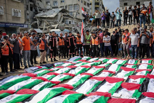 Palestinians Hold Mass Funeral for 105 Recovered from Gaza Rubble Palestinians take part in a mass funeral for 105 Palestinians whose remains were recovered from beneath the rubble of destroyed buildings in the al-Taj area of Gaza City’s al-Yarmouk neighborhood on October 1, 2026. The victims, including women and children, were killed in Israeli airstrikes during the early stages of the war, with families gathering for their funeral and burial after their remains had been trapped under the rubble for years. Photo by Mohammed Salha apaimages Gaza Gaza Strip Palestinian Territory 011026_Gaza_MS_00(1) Copyright: xapaimagesxMohammedxSalhax xapaimagesx