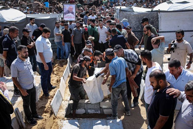 Palestinians Hold Mass Funeral for 105 Recovered from Gaza Rubble Palestinians take part in a mass funeral for 105 Palestinians whose remains were recovered from beneath the rubble of destroyed buildings in the al-Taj area of Gaza City’s al-Yarmouk neighborhood on October 1, 2026. The victims, including women and children, were killed in Israeli airstrikes during the early stages of the war, with families gathering for their funeral and burial after their remains had been trapped under the rubble for years. Photo by Mohammed Salha apaimages Gaza Gaza Strip Palestinian Territory 011026_Gaza_MS_00(12) Copyright: xapaimagesxMohammedxSalhax xapaimagesx