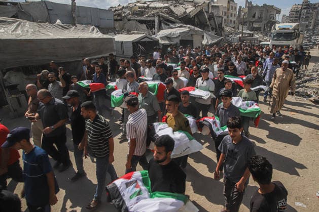Funeral Held For Palestinians Killed In Israel-Hamas War - Gaza A mass funeral takes place for 110 Palestinians who were killed in Israeli strikes early in the Israel-Hamas war on October 1, 2026 in Gaza City, Gaza. The remains of the victims have recently been recovered from the rubble of buildings destroyed in the Al-Taj area of Gaza City. Ramez Photo by Habboub ABACAPRESS.COM Gaza Palestine  Copyright: xHabboubxRamez ABACAx