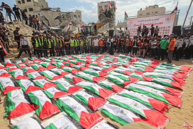 Funeral Held For Palestinians Killed In Israel-Hamas War - Gaza A mass funeral takes place for 110 Palestinians who were killed in Israeli strikes early in the Israel-Hamas war on October 1, 2026 in Gaza City, Gaza. The remains of the victims have recently been recovered from the rubble of buildings destroyed in the Al-Taj area of Gaza City. Ramez Photo by Habboub ABACAPRESS.COM Gaza Palestine  Copyright: xHabboubxRamez ABACAx