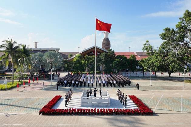 (261001) -- HAIKOU, Oct. 1, 2026 -- A flag-raising ceremony marking the 77th anniversary of the founding of the People s Republic of China is held at Fenghuang International Airport in Sanya, south China s Hainan Province, Oct. 1, 2026. CHINA-HAINAN-NATIONAL DAY-FLAG-RAISING CEREMONY (CN) YangxGuanyu 