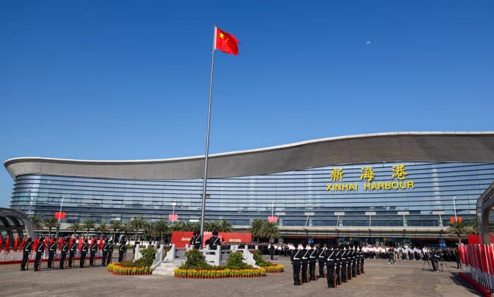 (261001) -- HAIKOU, Oct. 1, 2026 -- A flag-raising ceremony marking the 77th anniversary of the founding of the People s Republic of China is held at Xinhai Harbour in Haikou, south China s Hainan Province, Oct. 1, 2026. ) CHINA-HAINAN-NATIONAL DAY-FLAG-RAISING CEREMONY (CN) YangxGuanyu