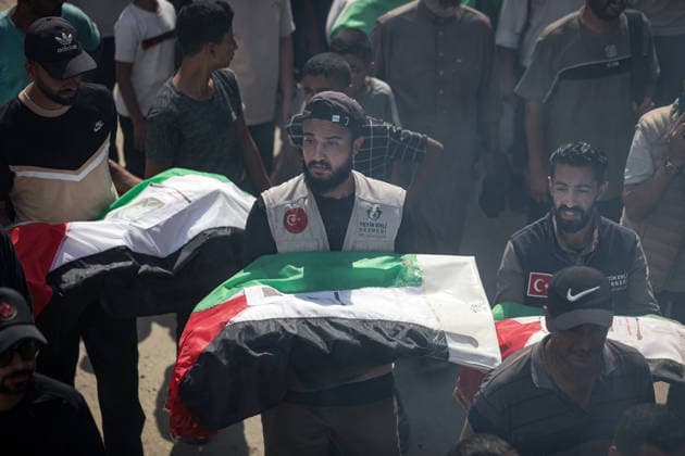 Palestinians Hold Mass Funeral for 105 Recovered from Gaza Rubble Palestinians take part in a mass funeral for 105 Palestinians whose remains were recovered from beneath the rubble of destroyed buildings in the al-Taj area of Gaza City’s al-Yarmouk neighborhood on October 1, 2026. The victims, including women and children, were killed in Israeli airstrikes during the early stages of the war, with families gathering for their funeral and burial after their remains had been trapped under the rubble for years. Photo by Bilal Osama apaimages Gaza city Gaza Strip Palestinian Territory 011026_Gaza_BO_00(12) Copyright: xapaimagesxBilalxOsamax xapaimagesx