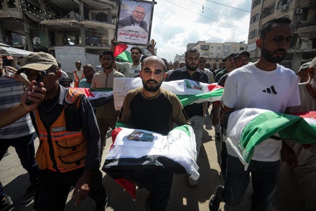 Palestinians Hold Mass Funeral for 105 Recovered from Gaza Rubble Palestinians take part in a mass funeral for 105 Palestinians whose remains were recovered from beneath the rubble of destroyed buildings in the al-Taj area of Gaza City’s al-Yarmouk neighborhood on October 1, 2026. The victims, including women and children, were killed in Israeli airstrikes during the early stages of the war, with families gathering for their funeral and burial after their remains had been trapped under the rubble for years. Photo by Bilal Osama apaimages Gaza city Gaza Strip Palestinian Territory 011026_Gaza_BO_00(14) Copyright: xapaimagesxBilalxOsamax xapaimagesx