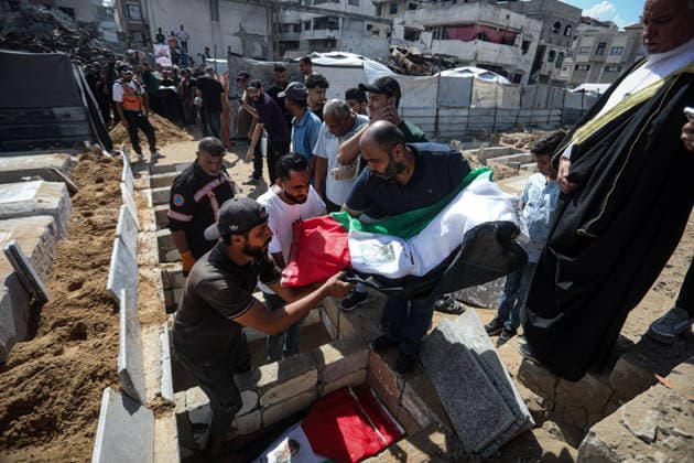 Palestinians Hold Mass Funeral for 105 Recovered from Gaza Rubble Palestinians take part in a mass funeral for 105 Palestinians whose remains were recovered from beneath the rubble of destroyed buildings in the al-Taj area of Gaza City’s al-Yarmouk neighborhood on October 1, 2026. The victims, including women and children, were killed in Israeli airstrikes during the early stages of the war, with families gathering for their funeral and burial after their remains had been trapped under the rubble for years. Photo by Bilal Osama apaimages Gaza city Gaza Strip Palestinian Territory 011026_Gaza_BO_00(15) Copyright: xapaimagesxBilalxOsamax xapaimagesx