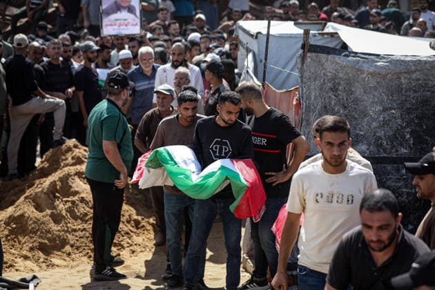 Palestinians Hold Mass Funeral for 105 Recovered from Gaza Rubble Palestinians take part in a mass funeral for 105 Palestinians whose remains were recovered from beneath the rubble of destroyed buildings in the al-Taj area of Gaza City’s al-Yarmouk neighborhood on October 1, 2026. The victims, including women and children, were killed in Israeli airstrikes during the early stages of the war, with families gathering for their funeral and burial after their remains had been trapped under the rubble for years. Photo by Bilal Osama apaimages Gaza city Gaza Strip Palestinian Territory 011026_Gaza_BO_00(16) Copyright: xapaimagesxBilalxOsamax xapaimagesx