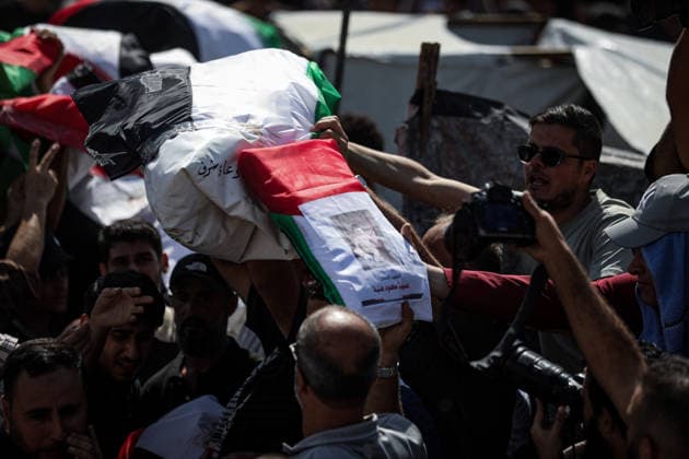 Palestinians Hold Mass Funeral for 105 Recovered from Gaza Rubble Palestinians take part in a mass funeral for 105 Palestinians whose remains were recovered from beneath the rubble of destroyed buildings in the al-Taj area of Gaza City’s al-Yarmouk neighborhood on October 1, 2026. The victims, including women and children, were killed in Israeli airstrikes during the early stages of the war, with families gathering for their funeral and burial after their remains had been trapped under the rubble for years. Photo by Bilal Osama apaimages Gaza city Gaza Strip Palestinian Territory 011026_Gaza_BO_00(27) Copyright: xapaimagesxBilalxOsamax xapaimagesx