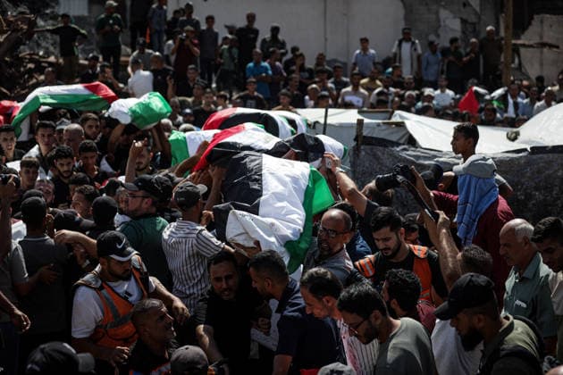 Palestinians Hold Mass Funeral for 105 Recovered from Gaza Rubble Palestinians take part in a mass funeral for 105 Palestinians whose remains were recovered from beneath the rubble of destroyed buildings in the al-Taj area of Gaza City’s al-Yarmouk neighborhood on October 1, 2026. The victims, including women and children, were killed in Israeli airstrikes during the early stages of the war, with families gathering for their funeral and burial after their remains had been trapped under the rubble for years. Photo by Bilal Osama apaimages Gaza city Gaza Strip Palestinian Territory 011026_Gaza_BO_00(28) Copyright: xapaimagesxBilalxOsamax xapaimagesx